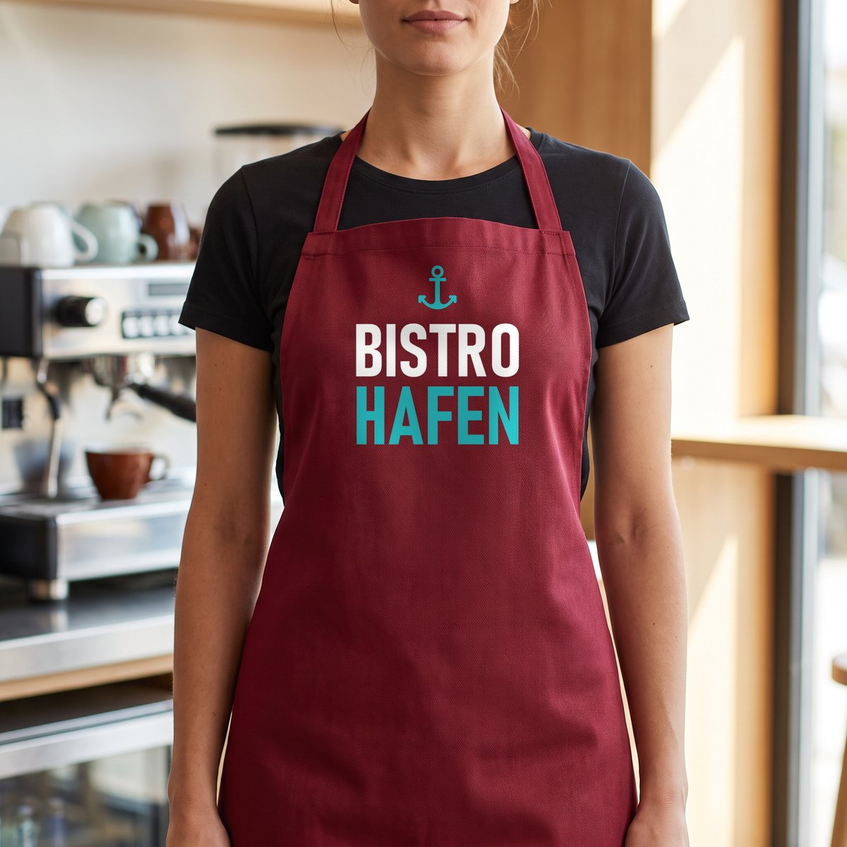 Burgundy bib apron made of polyester blend, printed with Blockout DTF, white and turquoise lettering of a bistro