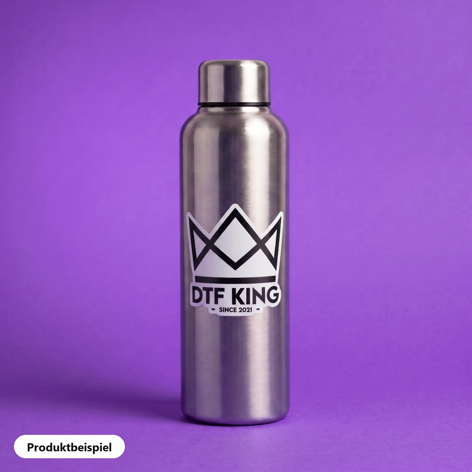 Contour-cut vinyl sticker on white film, matt laminated, with the DTF KING logo on a stainless steel drinking bottle