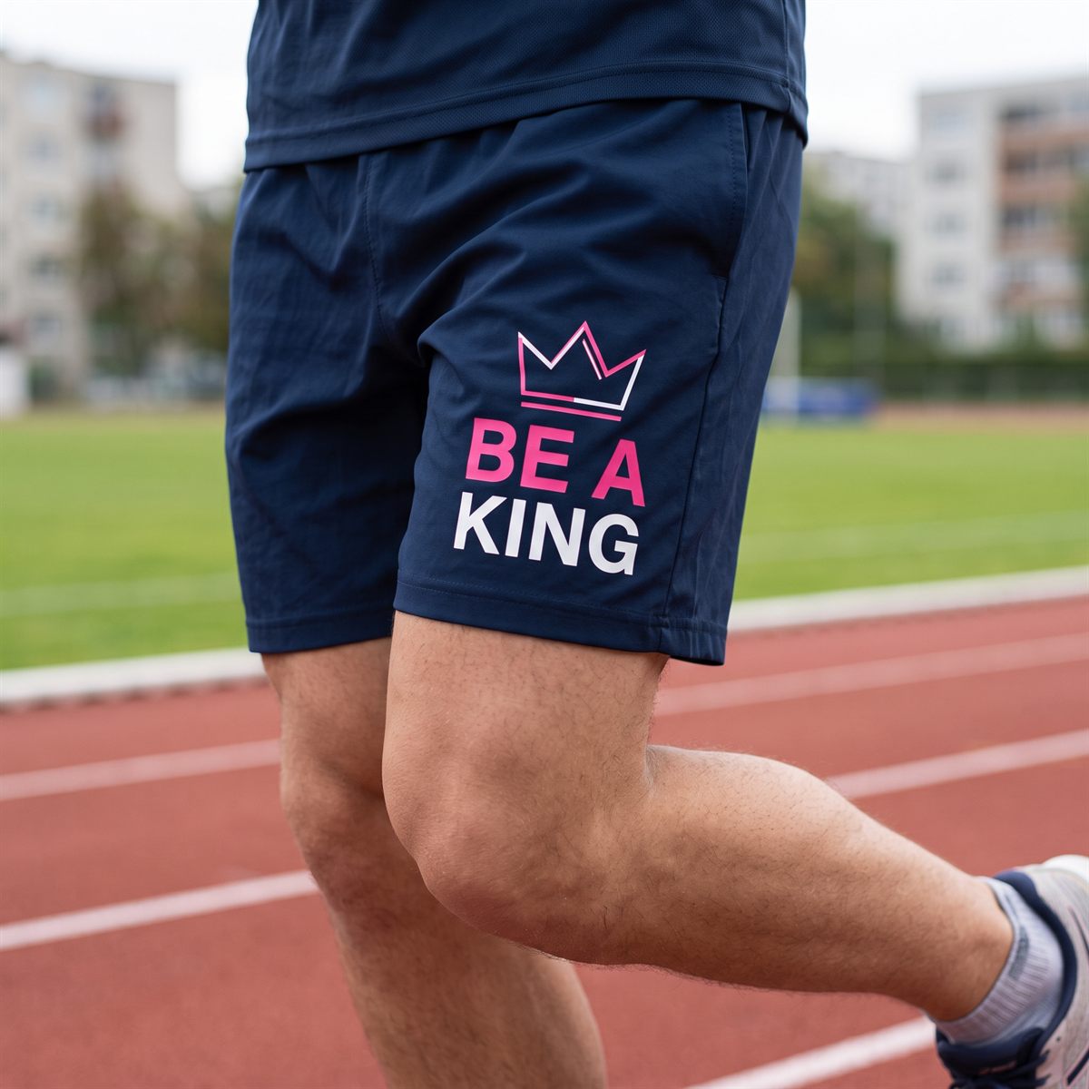 Navy sports shorts printed with a DTF transfer, pink lettering on the thigh