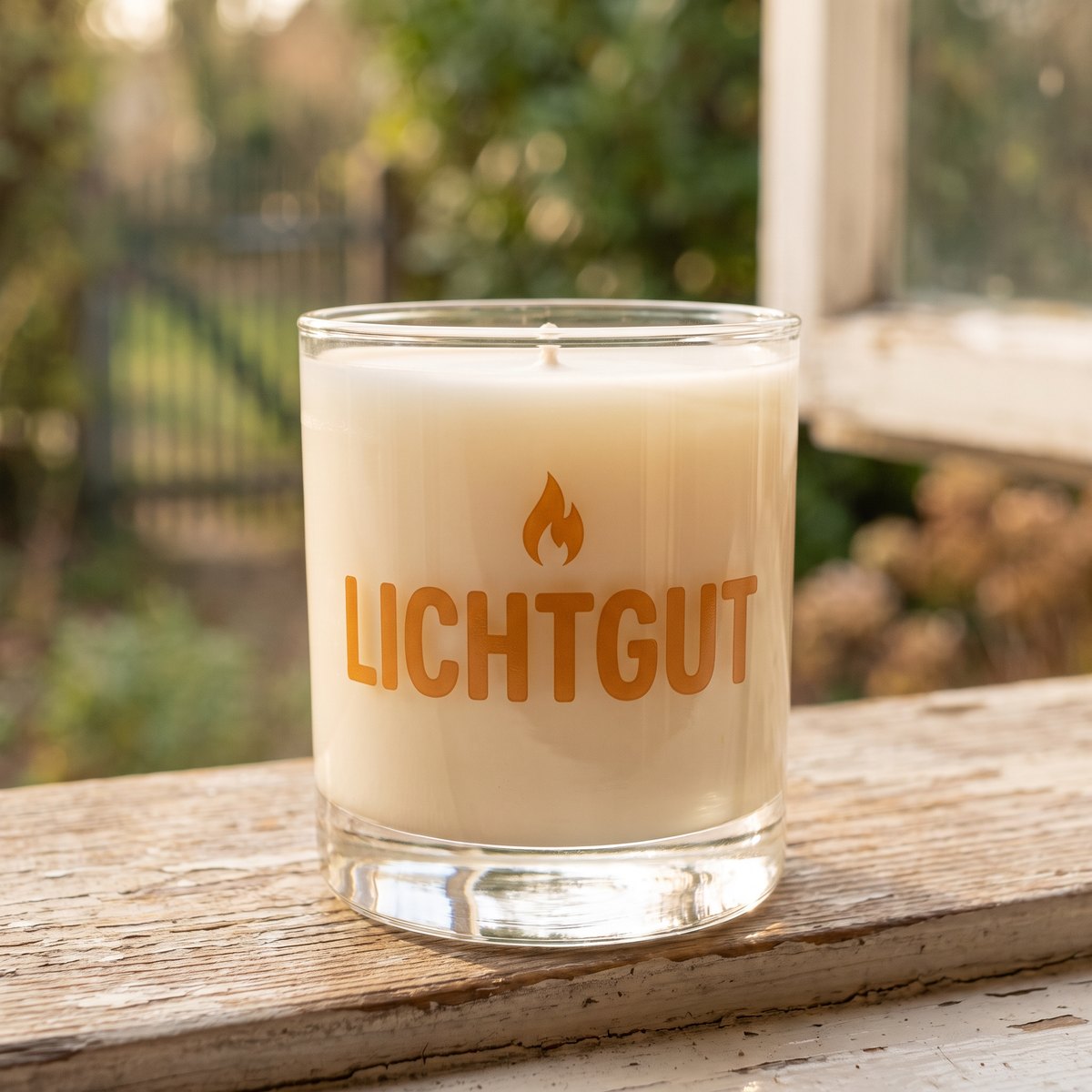Candle jar with a transparent UV DTF rub-on sticker, amber lettering without white, the wax shows through