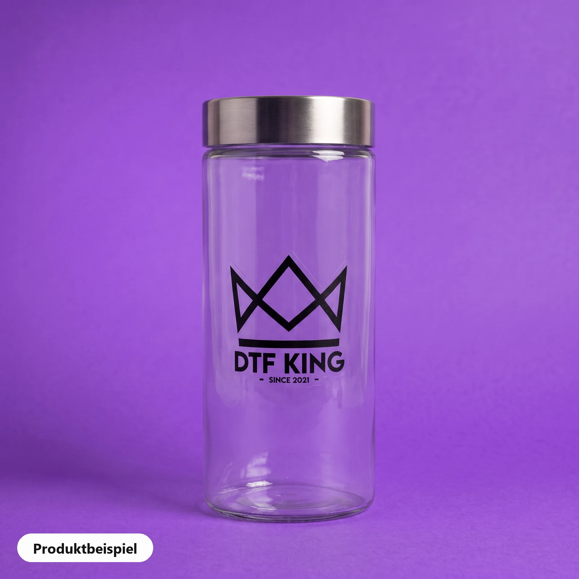 Contour-cut vinyl sticker on clear film, matt laminated, with the DTF KING logo on a storage jar